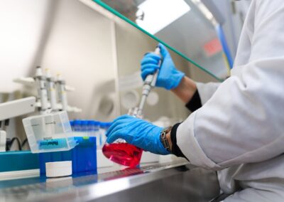 A technician prepares to plate cancer cells in specialized flasks with specialized medium at Shuttle Pharma Laboratories.